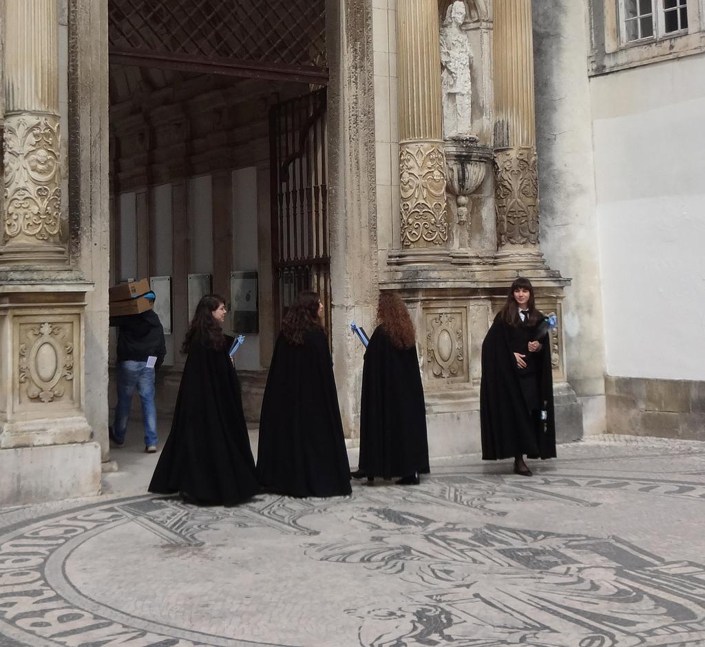 Coimbra graduating students in traditional black capes
